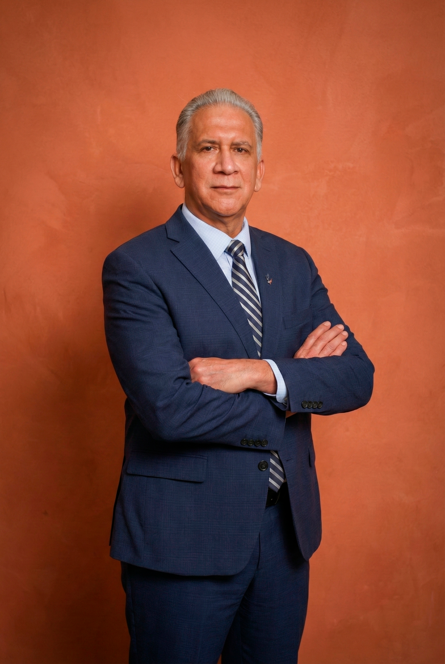 Fernando Triana speaking at an event, representing Latino communities in Alberta.